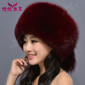 Woman wearing real fur winter fox raccoon fur hat with a Russian fur tail new fashion