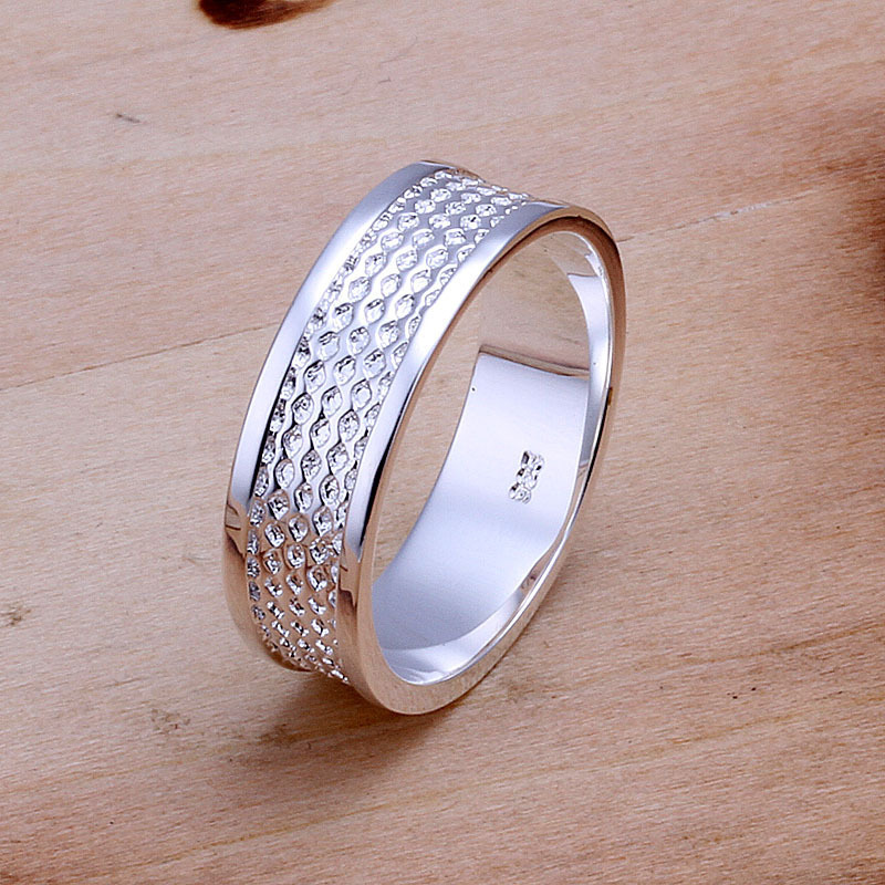 Silver ring on wedding finger